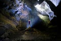 Phong Nha Ke national park / Vietnam, 15/11/2017: Backlit woman standing on a rock inside the Hang Tien cave in the Phong Nha Ke