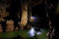 Phong Nha Ke national park / Vietnam, 16/11/2017: Group ziplining over an underground river inside the giant Hang Tien cave in the