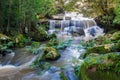 Phonpob waterfall, beautiful waterfall in a forest filled with green trees at Phu Kradung National Park in the rainy season, Royalty Free Stock Photo