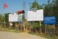 Signs set by the Mines Advisory Group at the entrance to the Site #1 of the Plain of Jars archaeological site in Phonsavan, Laos.