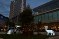 Phosphorescent deers walking around the Christmas tree installed in Westfield Stratford City shopping centre playground.