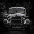 Black and White Abandoned Old Rusted Pickup Truck .