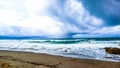 Amban beach with waves accompanied by cloudy sky Royalty Free Stock Photo