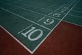 Photo from above. Green numbered stripes for races of athletes in competition Royalty Free Stock Photo