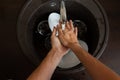 Photo from above of man`s hands washing white plates Royalty Free Stock Photo