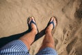 Photo from above. a man in spanking stands on the sand