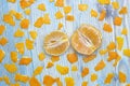 Photo from above of the peeled tangerine and many peices of orange peel. Two parts of peeled slice juicy tangerine. Royalty Free Stock Photo