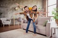 Photo of adorable beautiful young lovers dressed casual clothes having fun piggy back arms sides smiling indoors loft Royalty Free Stock Photo