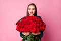 Photo of adorable charming lady hold large red long roses bouquet boyfriend birthday gift surprise hear pleasant smell