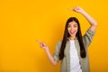 Photo of adorable cute young business lady promote her company services isolated on yellow color background Royalty Free Stock Photo