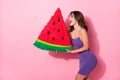 Photo of adorable funny young woman dressed violet dress holding big watermelon pinata isolated pastel pink color