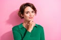 Photo of intelligent girl with bob hairdo dressed green shirt hold finger on chin think business isolated on pink color