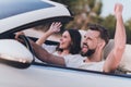 Photo of adorable lucky husband wife wear casual clothes riding cabriolet rising fist celebrating summer trip