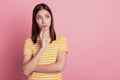 Photo of adorable ponderous clever lady look side blank space imagine ideas on pink background
