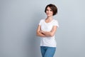 Photo of adorable pretty lady wear white t-shirt arms folded empty space isolated grey color background