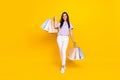 Photo of adorable satisfied lady striped outfit arm hold raise bag enjoy rejoice black friday shopping isolated on