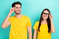 Photo advertisement of two young people husband with wife wear eyeglasses vision checkup look each other isolated on