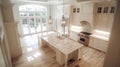 A photo of an aerial view of a kitchen in the classic French style with white cabinets and a marble island countertop Royalty Free Stock Photo