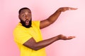 Photo of afro american brunette haired stylish man amazed show object empty space size isolated on pink color background