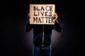 Photo of afro american guy close cover face cardboard banner demonstrate hope inspire message for human tolerance wear