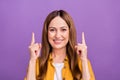 Photo of aged attractive woman point fingers empty space ad promo choice discount isolated over violet color background