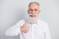Photo of aged man happy positive smile show thumb-up like cool advert perfect advise  over grey color background Royalty Free Stock Photo