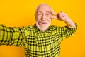 Photo of aged man happy smile fooling tongue-out show peace cool v-sign make selfie isolated over yellow color