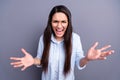 Photo of aggressive angry mature woman wear formal shirt spectacles rising arms isolated grey color background