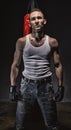 Photo of aggressive man and red boxing bag Royalty Free Stock Photo