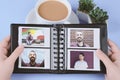 Photo album with instant photos of young latin man