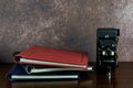 Photo Albums and Old Folding Camera on a Polished Wooden Surface Royalty Free Stock Photo