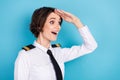 Photo of amazed excited happy young woman hold hands forehead look forward empty space isolated on blue color background