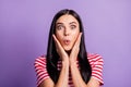 Photo of amazed funny lady arms cheekbones open mouth wear striped red shirt purple color background