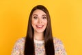 Photo of amazed happy nice young charming woman smile good mood wear pullover isolated on yellow color background Royalty Free Stock Photo