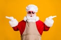 Photo of amazed santa claus with beard in chef cap hold hand compare x-mas christmas newyear magic cook meal discounts Royalty Free Stock Photo