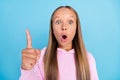 Photo of amazed shocked astonished young girl point finger idea genius trendy on blue color background