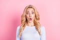 Photo of amazed shocked astonished young woman reaction news isolated on pastel pink color background