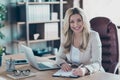 Photo of amazing blond business lady notebook table signing contract important partner prepared documents sitting chair Royalty Free Stock Photo