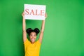 Photo of amazing dark skin lady raising above head placard shop black friday sale inviting customers to visit season Royalty Free Stock Photo