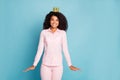 Photo of amazing dark skin wavy lady overjoyed to be prom queen shy person wear golden crown pink shirt pants isolated Royalty Free Stock Photo