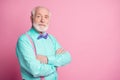 Photo of amazing stylish look grandpa hands crossed seriously facial expression wear mint shirt suspenders violet bow