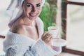 Photo of amazing young lady dressed head turban fluffy bathrobe enjoy coffee after spa salon procedure saturday morning Royalty Free Stock Photo