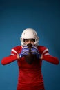 Photo of american girl football player in white helmet, sportswear and ball in her hands Royalty Free Stock Photo
