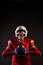 Photo of American woman football player in helmet with rugby ball in her hands on blank black background Royalty Free Stock Photo