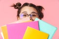 Photo amusing nice girl covering her face with exercise books