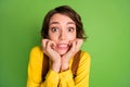 Photo of anxious scared girl gnaw nails look camera wear yellow shirt overall isolated green color background