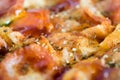 Photo, appetizing pizza with sausage, cheese, tomatoes and mayonnaise close-up,selective focus.