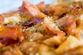 Photo, appetizing pizza with sausage, cheese, tomatoes and mayonnaise close-up,selective focus.