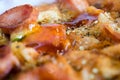 Photo, appetizing pizza with sausage, cheese, tomatoes and mayonnaise close-up,selective focus.