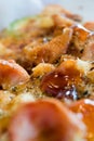 Photo, appetizing pizza with sausage, cheese, tomatoes and mayonnaise close-up,selective focus.